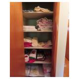CONTENTS OF LINEN CLOSET IN HALLWAY