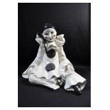 SEATED PIERROT CLOWN FIGURINE