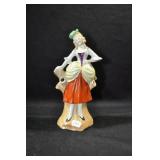 LADY IN ORANGE SKIRT AND GREEN HAT - 7" MARKED: