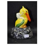 CHILD ON PELICAN - 4" CHILDS HEAD HAS BEEN