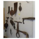 CONTENTS OF PEG B0ARD: CAST IRON SPINDLES, SAW,