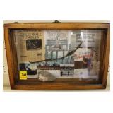 DISPLAY WITH ROCK AND BARB WIRE FROM BERLIN WALL