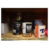 CONTENTS OF SHELVES: VINTAGE OIL CANS, ARKAY