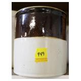 BROWN AND WHITE CROCK WITH SMALL CHIP AROUND