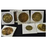 7 GOLD COLORED COMMEMORATIVE COINS/TOKENS