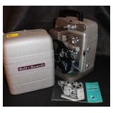 BELL AND HOWELL 8MM PROJECTOR AND SCREEN