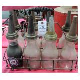 VINTAGE 8 GLASS QUART OIL BOTTLES WITH SPOUTS AND VINTAGE 8 GLASS QUART OIL BOTTLES WITH SPOUTS AND