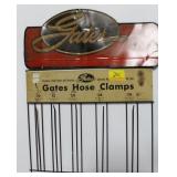 2 GATES ADVERTISING ITEMS: TIN SIGN AND HOSE