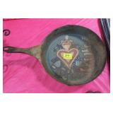 11 1/2" IRON SKILLET WITH FOLK ART PAINTING RUSTY