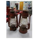 2 RED BARN LANTERNS 1 DAMAGED AROUND BASE