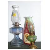 2 OIL LAMPS AND A BOTTLE OF LAMP OIL SMALLER LAMP