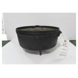 #12 LODGE CAST IRON DUTCH OVEN ON FEET WITH #12 LODGE CAST IRON DUTCH OVEN ON FEET WITH