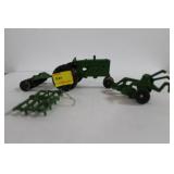 GREEN TOY TRACTOR WITH PLOW, DISC AND HARROW