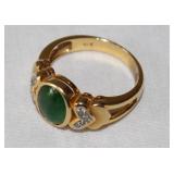 GREEN STONE RING MARKED 18K NOT SURE IF ITS