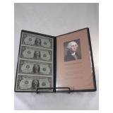 Uncut Sheet of Five $1 bills in binder