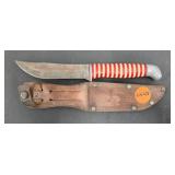 SCHRADE RED AND WHITE STACKED HANDLE KNIFE