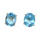 14K Yellow gold oval cut claw set blue topaz stud