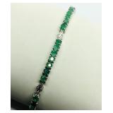 Sterling silver round mix cut claw set emerald