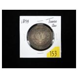 1879 Morgan dollar, toned, Unc.