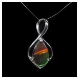 Sterling silver claw set ammolite pendant
