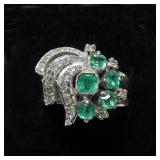 Sterling silver bezel and claw set emerald