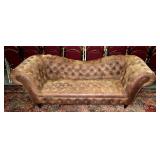 Distressed leather button tuck sofa,