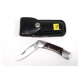 Buck 500 folding knife with leather sheath