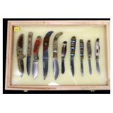 Lot: Folding Knife collection in glass top display