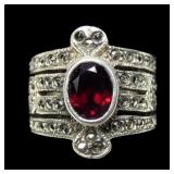 Sterlng silver bezel set oval cut garnet in