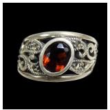 Sterling silver oval cut bezel set ring in