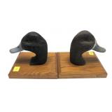 Pair of W. Schmidt duck decoy heads on wooden