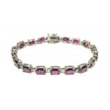 Sterling silver 7.5" oval cut garnet bracelet,