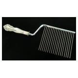 Sterling handled cake comb