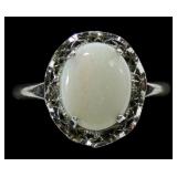 Sterling silver claw set cabochon opal ring in