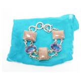 Sterling silver double link bezel set oval cut