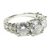 Platinum round cut three-stone diamond ring,