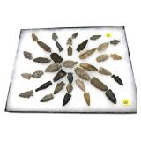 Collection of Native American stone arrow heads,