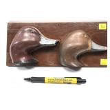 Pair of Redhead decoy heads on wooden plaque,
