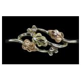 Sterling silver botanical design ring with 10K