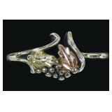 Sterling silver floral motif ring with 10K rose