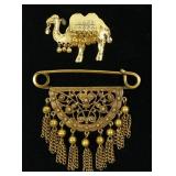 Lot, Persian design brooch and camel pendant,