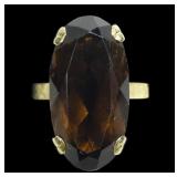 14K Yellow gold claw set elongated oval cut smoky