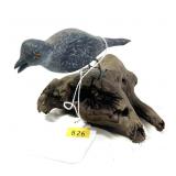 Wooden carved small shore bird on drift wood,