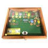 Lot: Assorted U.S. Medals and Insignia in glass