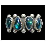 Sterling silver pear shape blue paua four-stone