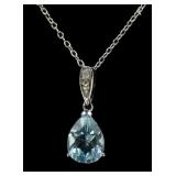 Sterling silver pear cut blue topaz diamond accent