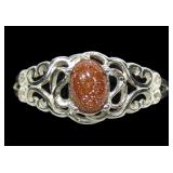 Sterling silver oval cabochon goldstone ring in