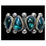 Sterling silver pear shape blue paua four-stone