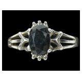 Sterling silver oval cut dark blue topaz ring in