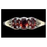 Sterling silver oval cut garnet three-stone ring,